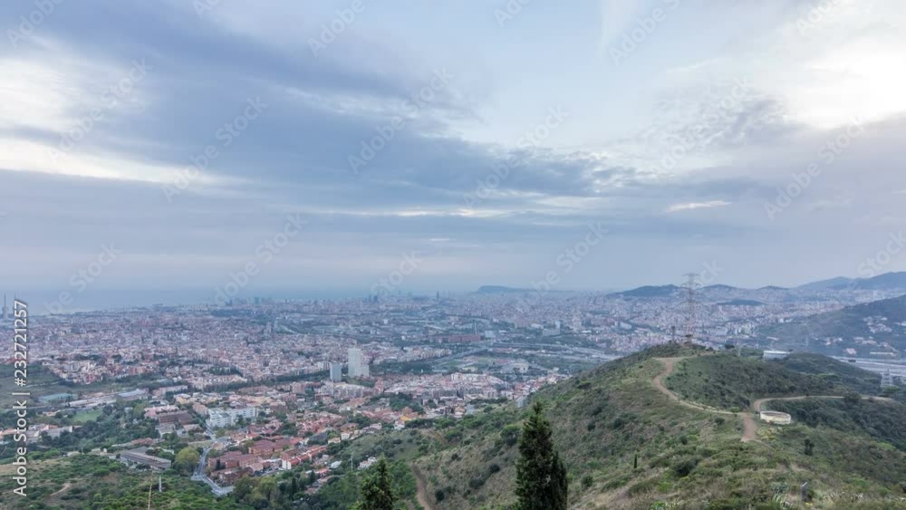 Barcelona and Badalona skyline with roofs of houses and sea on the horizon at evening timelapse Barcelona and Badalona skyline with roofs of houses and sea on the horizon at evening timelapse