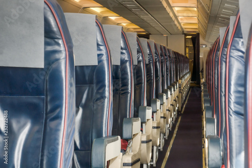 Economy class cabin in a modern civil airplane.