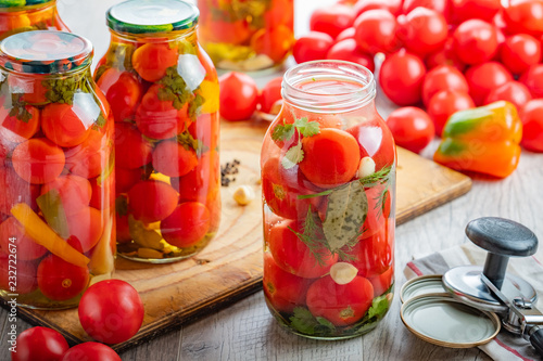 Obraz na plátně Homemade pickled tomatoes in jar. Selective focus.