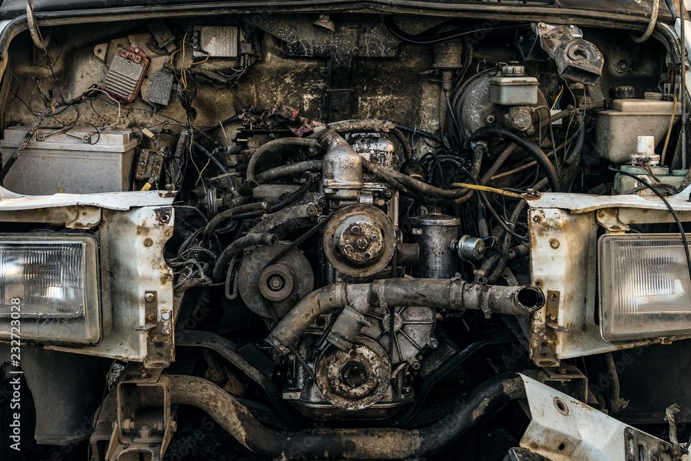 Engine compartment of an old car. Open hood with old cars details, auto-waste.