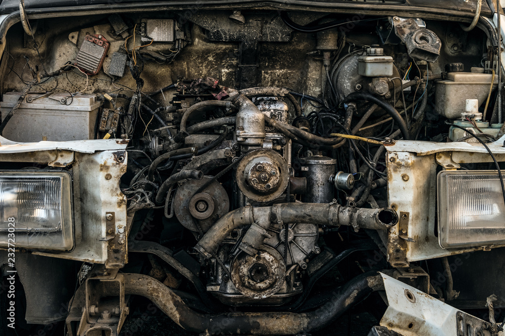Engine compartment of an old car. Open hood with old cars details, auto-waste. Engine compartment of an old car. Open hood with old cars details, auto-waste.