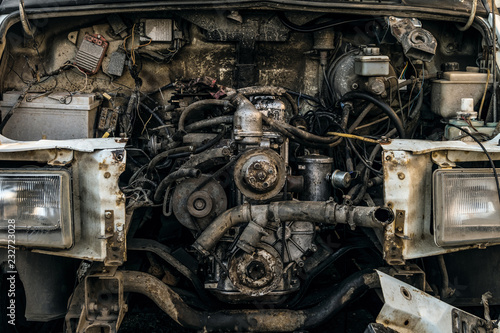 Engine compartment of an old car. Open hood with old cars details, auto-waste.