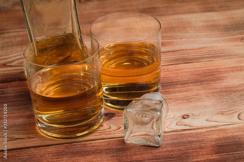 Glasses for whiskey on a wooden table Glasses for whiskey on a wooden table