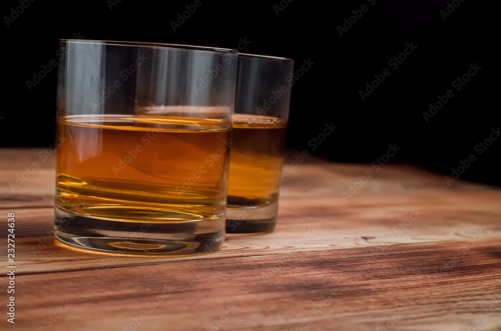 Glasses for whiskey on a wooden table Glasses for whiskey on a wooden table