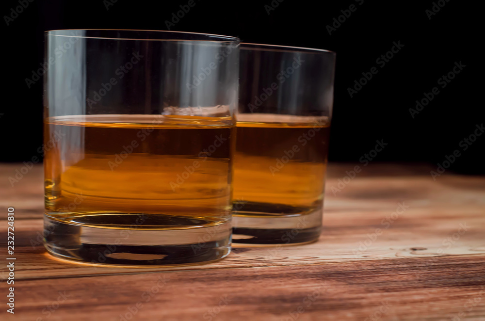 Glasses for whiskey on a wooden table Glasses for whiskey on a wooden table