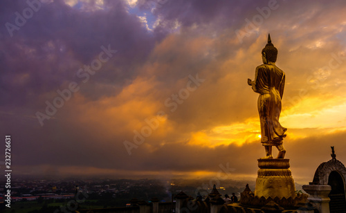 Great Golden Buddha statue at the"Wat Phra That Kao Noi" , Nan province, Thailand with sky Twilight time