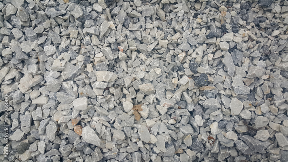Small piles of limestone for use in lime kiln line . Limestone gravel background Texture. Small piles of limestone for use in lime kiln line . Limestone gravel background Texture.