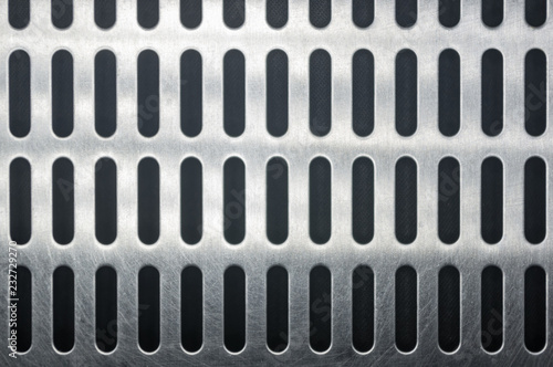 stainless steel grating with oblong holes, close-up