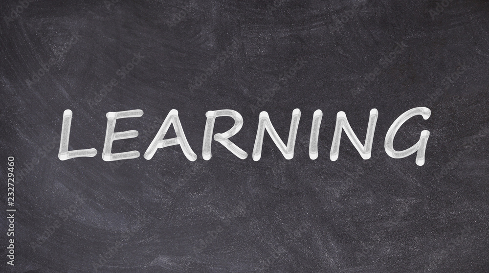 Obraz premium Learning written on blackboard