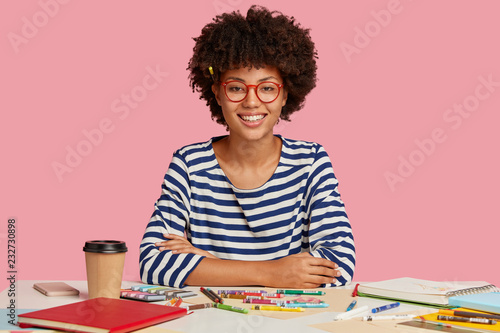 Εκτύπωση καμβά Glad mixed race student studies art at workplace, has ability and skills for dra