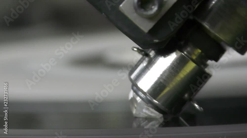 A diamond held by dop is polished