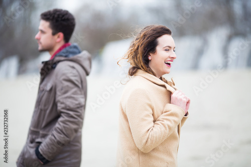 Young beautiful couple  together outdoors at cold windy weather © bokan