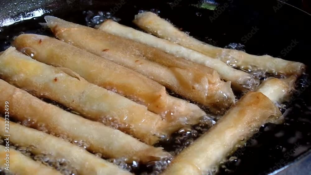 Deep frying rolled up various vegetable lumpia sorties Deep frying rolled up various vegetable lumpia sorties