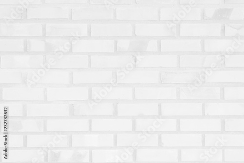 White and Gray brick wall texture background. Brickwork or stonework flooring interior rock old pattern clean concrete grid uneven bricks design stack. © Phokin