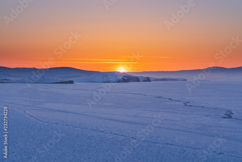 Panoramic frozen landscape in winter sunset at frozen lake Baikal in Siberia, Russia © SasinParaksa