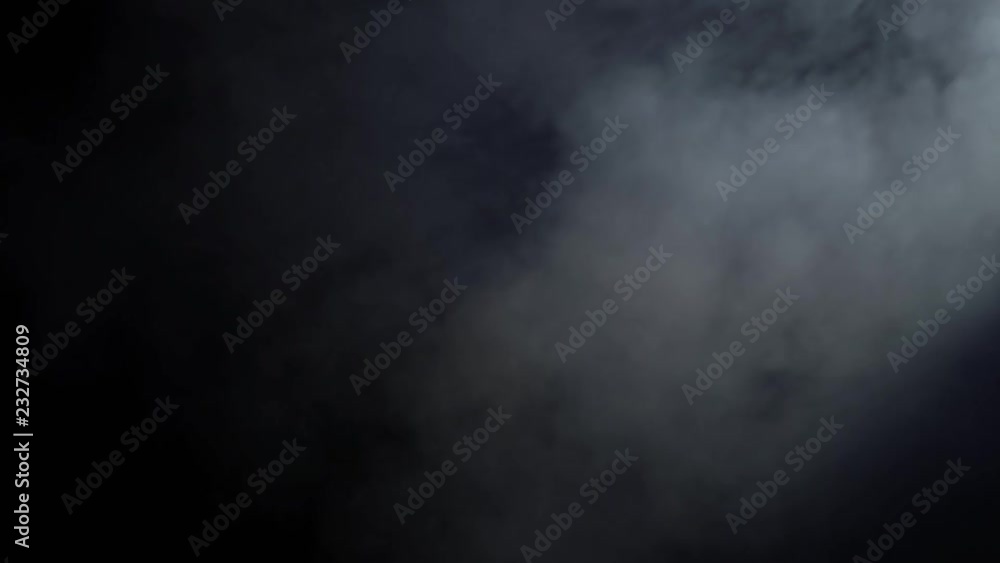 Smoke cloud on black background in blue light Smoke cloud on black background in blue light
