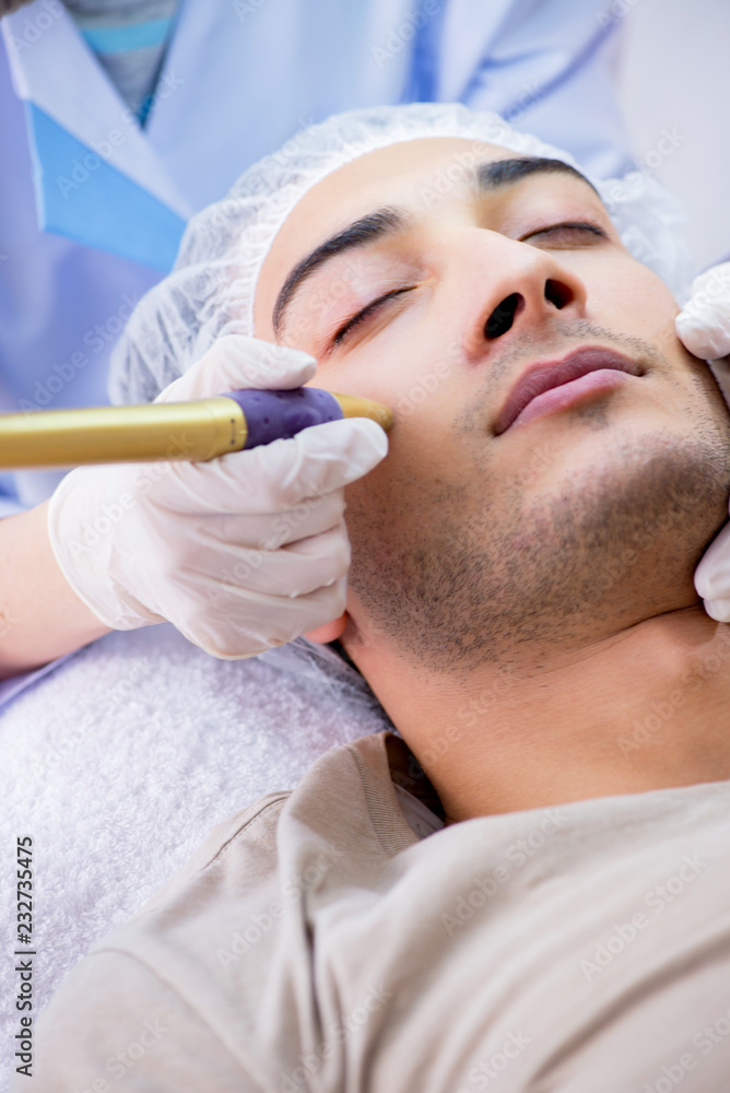 Man visiting dermatologyst for laser scar removal Man visiting dermatologyst for laser scar removal