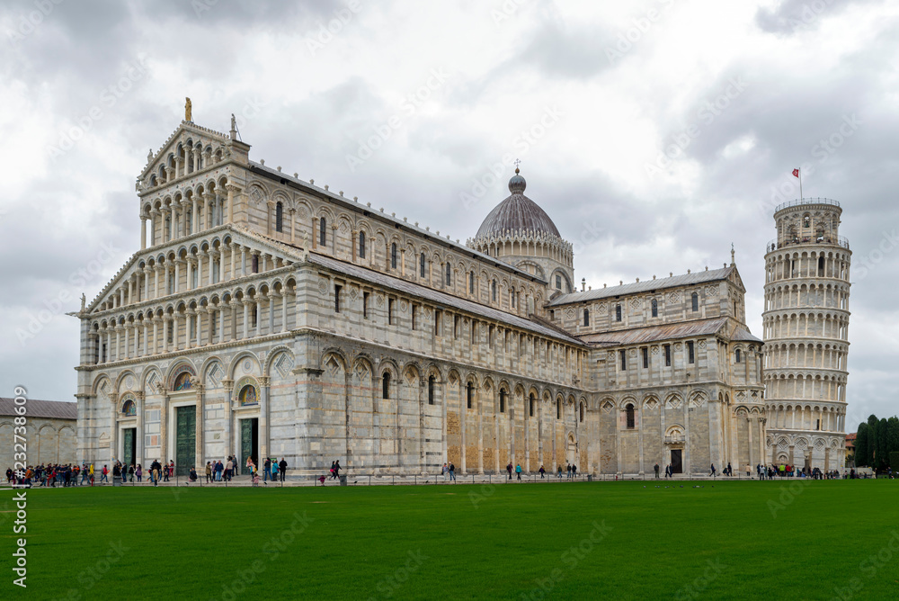 PISA, ITALY - OCTOBER 29, 2018: The Piazza dei Miracoli, formally known as Piazza del Duomo is  recognized as an important centre of European medieval artmplexes in the world