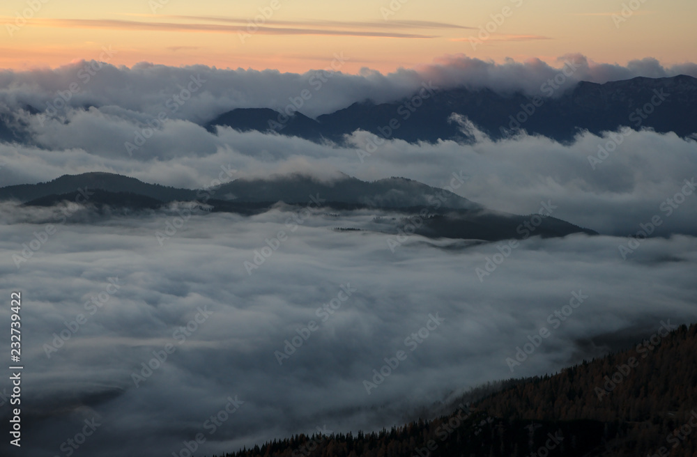 Beautiful sunrise with fog in the mountains