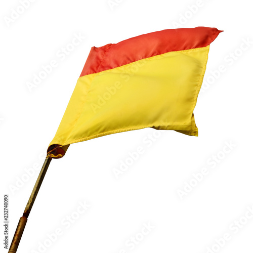 Obraz na plátně A red and yellow beach safety flag swaying in the wind