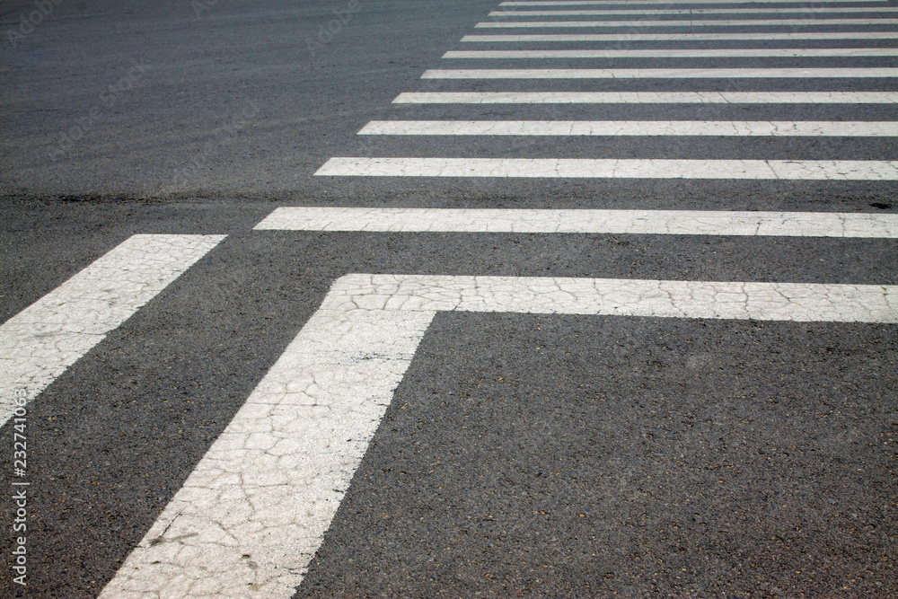 zebra crossing on asphalt pavement, closeup photo zebra crossing on asphalt pavement, closeup photo