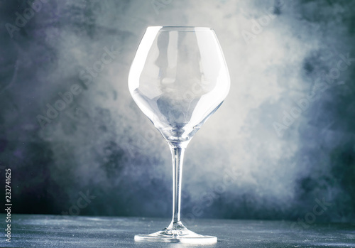 Empty wine glass for red wine, gray background, selective focus