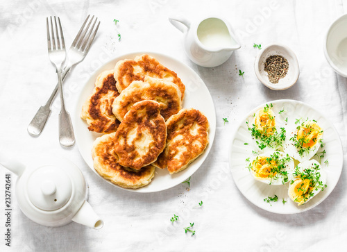 Wallpaper Mural Served brunch - potato scones and boiled eggs on a light background, top view. Delicious breakfast, snack, appetizer Torontodigital.ca