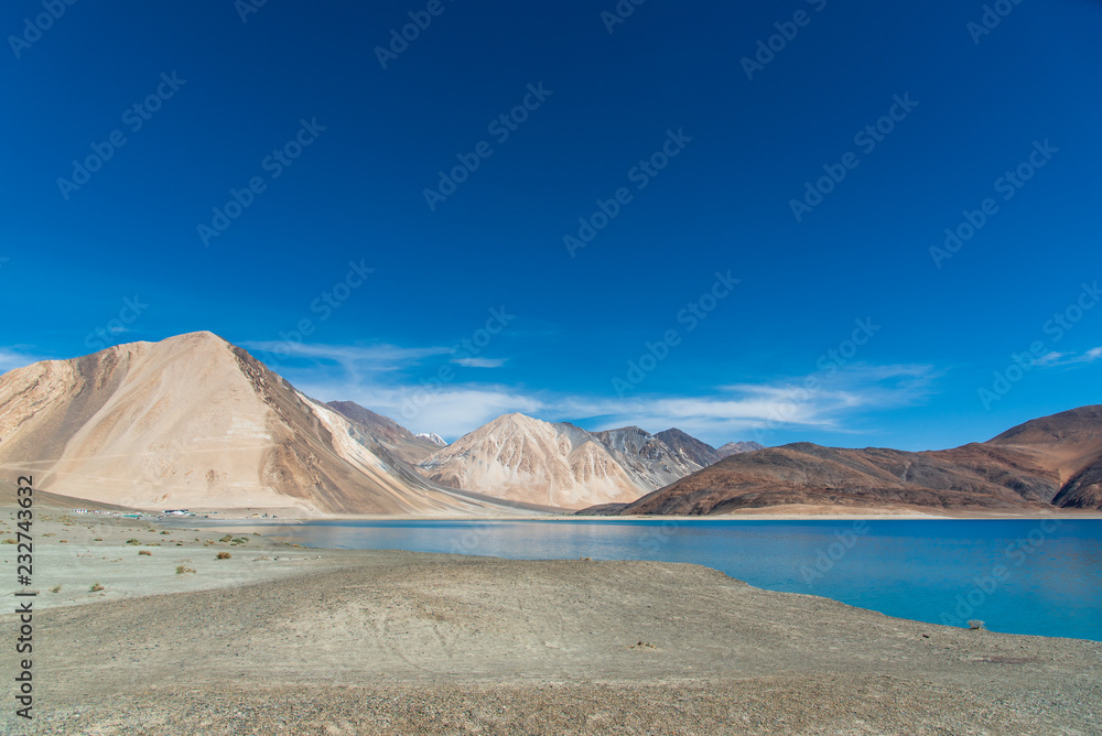 Landscape with lake, mountains and blue sky. Landscape with lake, mountains and blue sky.