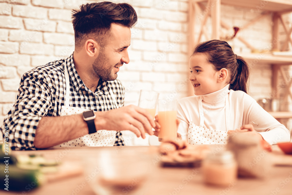 Smiling Girl with Carafe Juice in Hand with Father