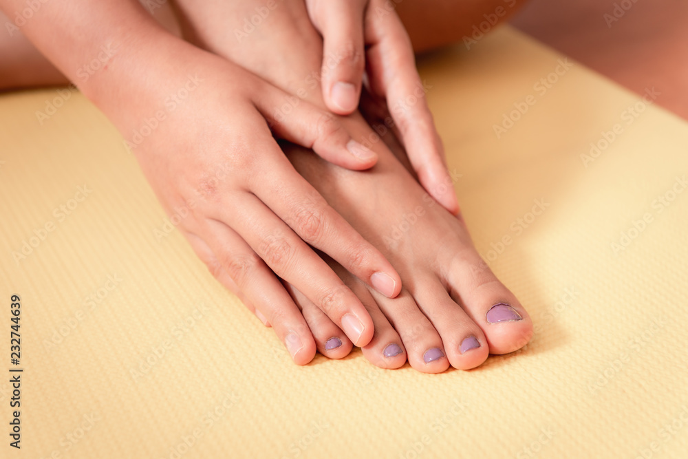 Close up of woman taking care of her feet, Healthcare concept