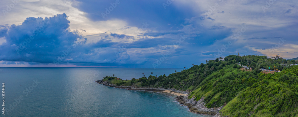 aerial view dark sunset at the rocky outcropping in the sea at Promthep cape.. Promthep cape is the most popular viewpoint in Phuket. the most tourist always come to see sunset at this landmark