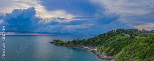 aerial view dark sunset at the rocky outcropping in the sea at Promthep cape.. Promthep cape is the most popular viewpoint in Phuket. the most tourist always come to see sunset at this landmark