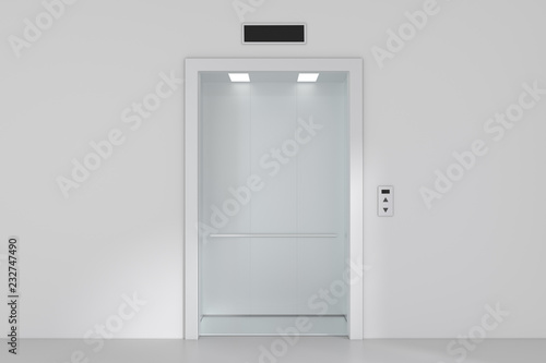 An empty modern elevator or lift with metal doors that are open.