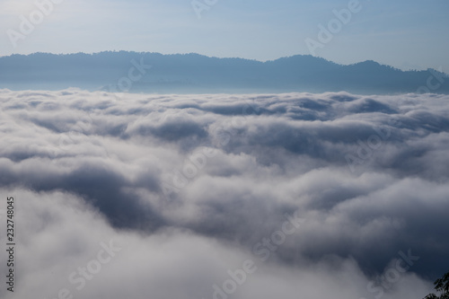 View of Fog covered the mountain in Aiyoeweng District  Southern Thailand  with trees.