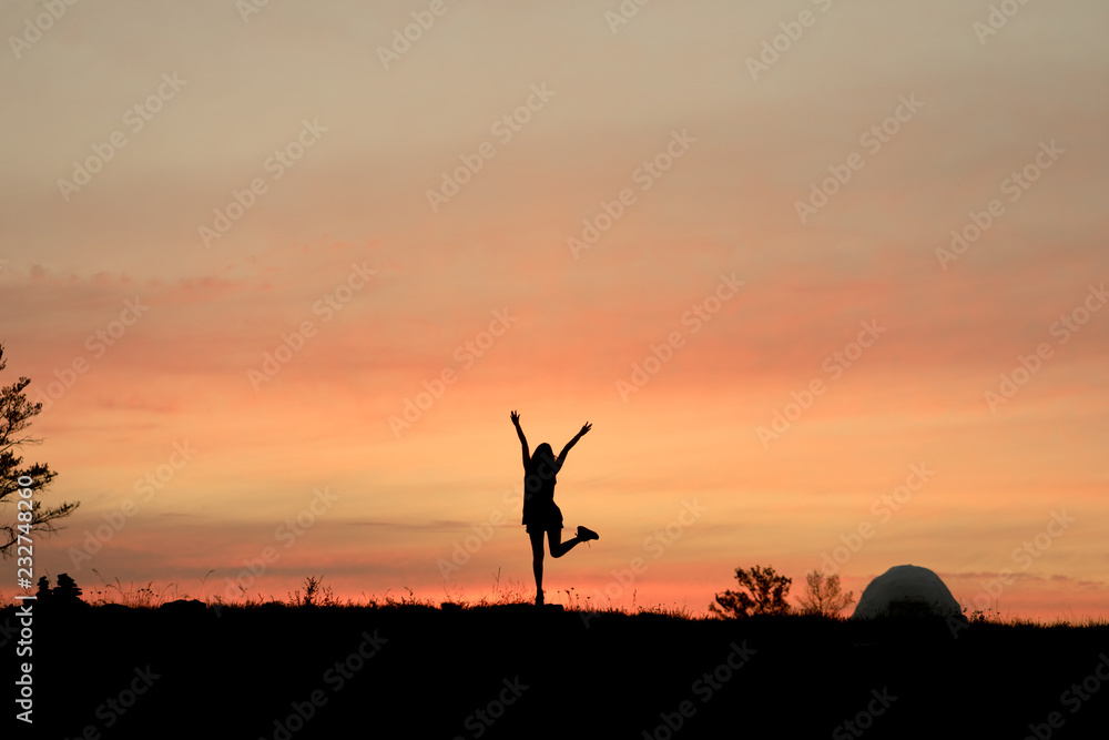 silhouette of girl in sunset