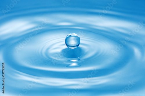 drop of water on blue water surface