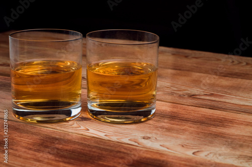 Glasses for whiskey on a wooden table