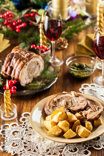 Traditional italian porchetta on festive table