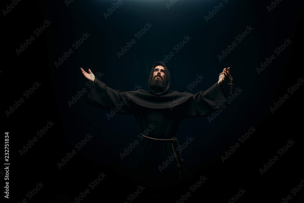 Medieval monk praying to the holy god, religion Medieval monk praying to the holy god, religion