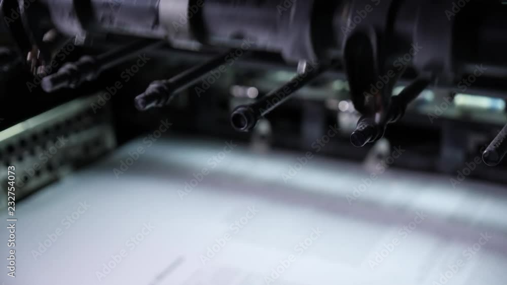Rotation of printing machine parts in a printing house. Professional printing machine in the printing house. Rotation of printing machine parts in a printing house. Professional printing machine in the printing house.