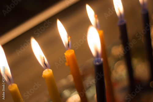 candle hanuka menora by window for jewish holiday