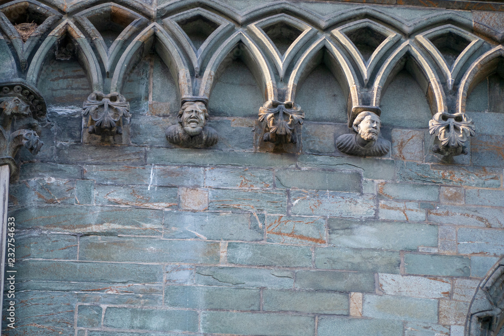 Church wall figures at the famous gothic church inside the city of Trondheim Church wall figures at the famous gothic church inside the city of Trondheim