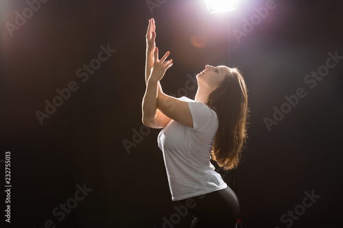 People and dancing concept - Close up of young athletic woman dancing street dance in studio