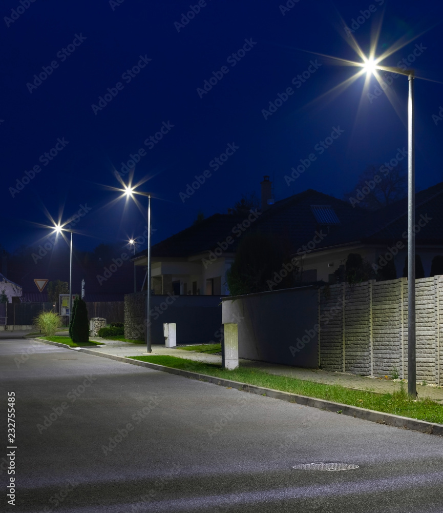 street in a residential area with modern streetlights