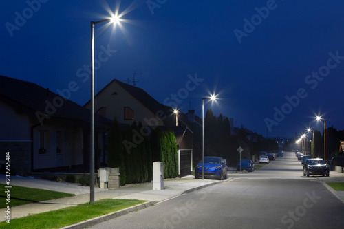 Fototapeta Naklejka Na Ścianę i Meble -  small city street with modern LED streetlights at night
