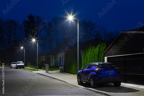 Fototapeta Naklejka Na Ścianę i Meble -  small city street with modern LED streetlights at night