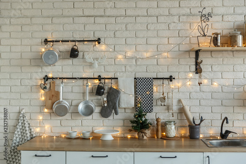 Interior light kitchen with christmas decor and tree