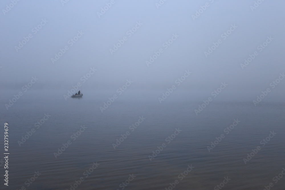 fishing boat in sea at sunset