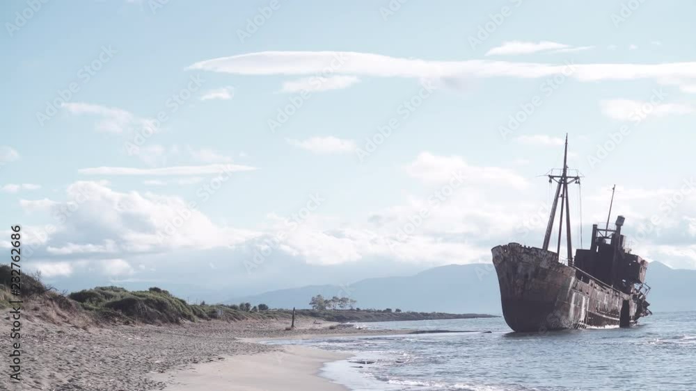 An old abandoned shipwreck, wrecked boat sunken ship stand on beach coast. Accident at sea. Time lapse 4K An old abandoned shipwreck, wrecked boat sunken ship stand on beach coast. Accident at sea. Time lapse 4K