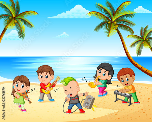 Boys and girls playing in band on the beach